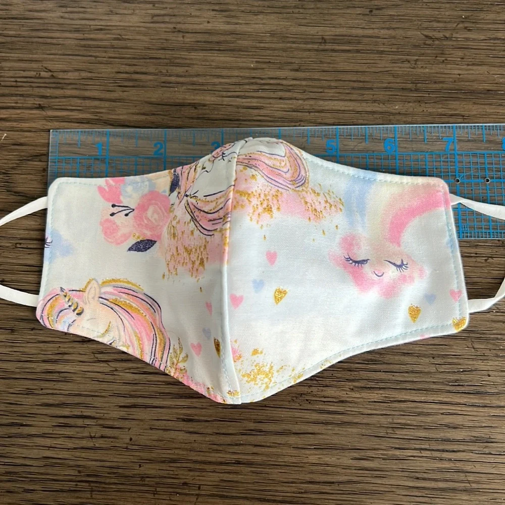 Pink lined white and blue unicorn clouds outer face mask